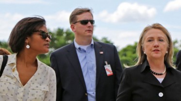 Cheryl Mills, left, walks with Secretary of State Hillary Clinton, center, Senator Patrick Leahy, and Hilda Solis, the U.S. Secretary of Labor as Clinton arrives at Caracol, Haiti, Monday, October 22, 2012. Clinton arrived to inaugurate the one tangible showcase of post-earthquake aid in Haiti, a controversial industrial park that is supposed to create 60,000 jobs in the coming years. Also along on the trip, former President Bill Clinton and more than two dozen leaders of major companies. The former president hopes to persuade the CEOs to invest in the troubled Caribbean country.