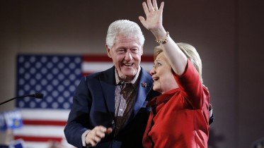 Democratic presidential candidate Hillary Clinton, right, waves on stage with her husband and former President Bill Clinton during a Nevada Democratic caucus rally, Saturday, Feb. 20, 2016, in Las Vegas. (AP Photo/John Locher)