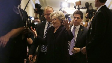 U.S. Democratic presidential candidate Hillary Clinton reacts to reporters' questions as she exits the hearing room for a lunch break from testimony before the House Select Committee on Benghazi on Capitol Hill in Washington October 22, 2015. The congressional committee is investigating the deadly 2012 attack on the U.S. diplomatic mission in Benghazi, Libya, when Clinton was the secretary of state.    REUTERS/Gary Cameron  TPX IMAGES OF THE DAY   - RTS5P5P